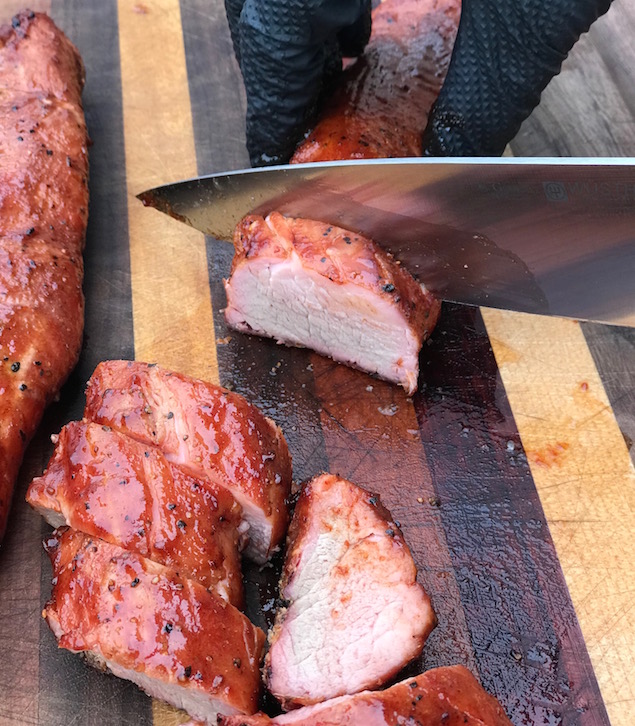 Smoked pork tenderloin getting sliced. So much yum!