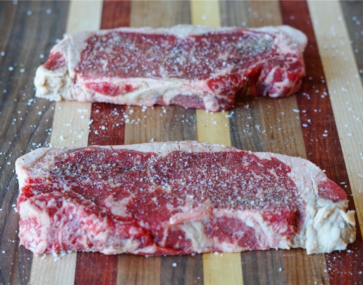 Seasoned New York Strip steaks. They have some decent marbling, too.