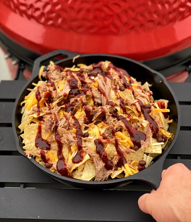 Layers of nachos put together and ready to hit the grill.