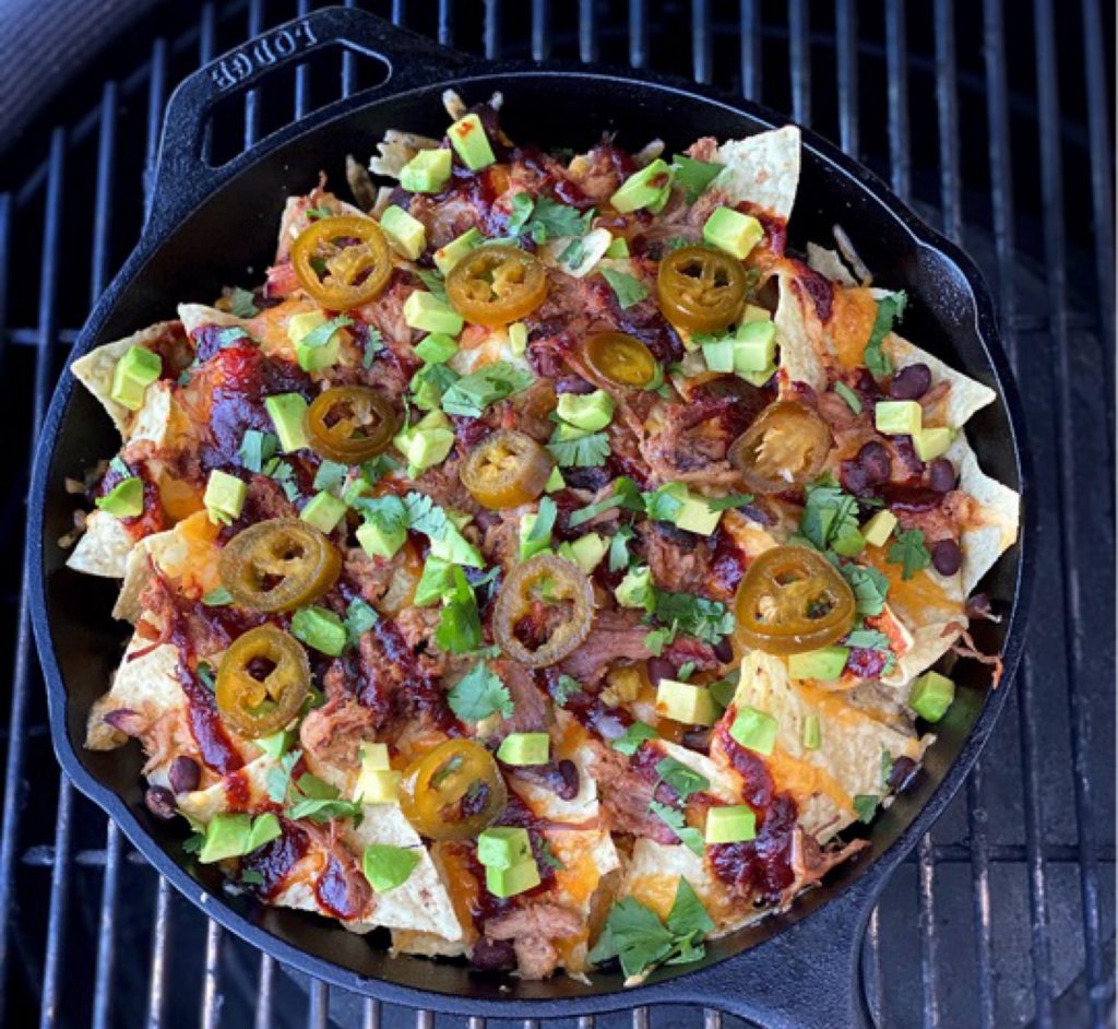 Pulled pork nachos finished and on the grill. How many are you eating?