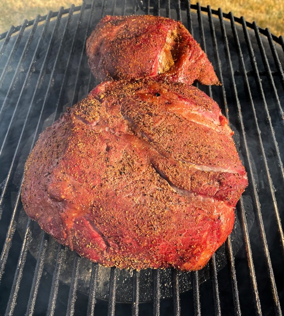 Chuck roast seasoned and smoked on the grill.
