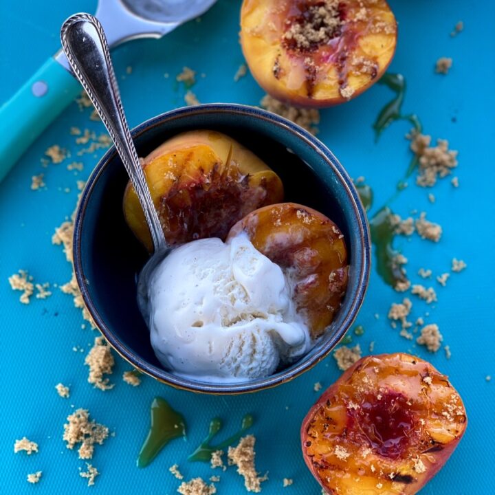 Grilled peaches served up with some vanilla bean ice cream