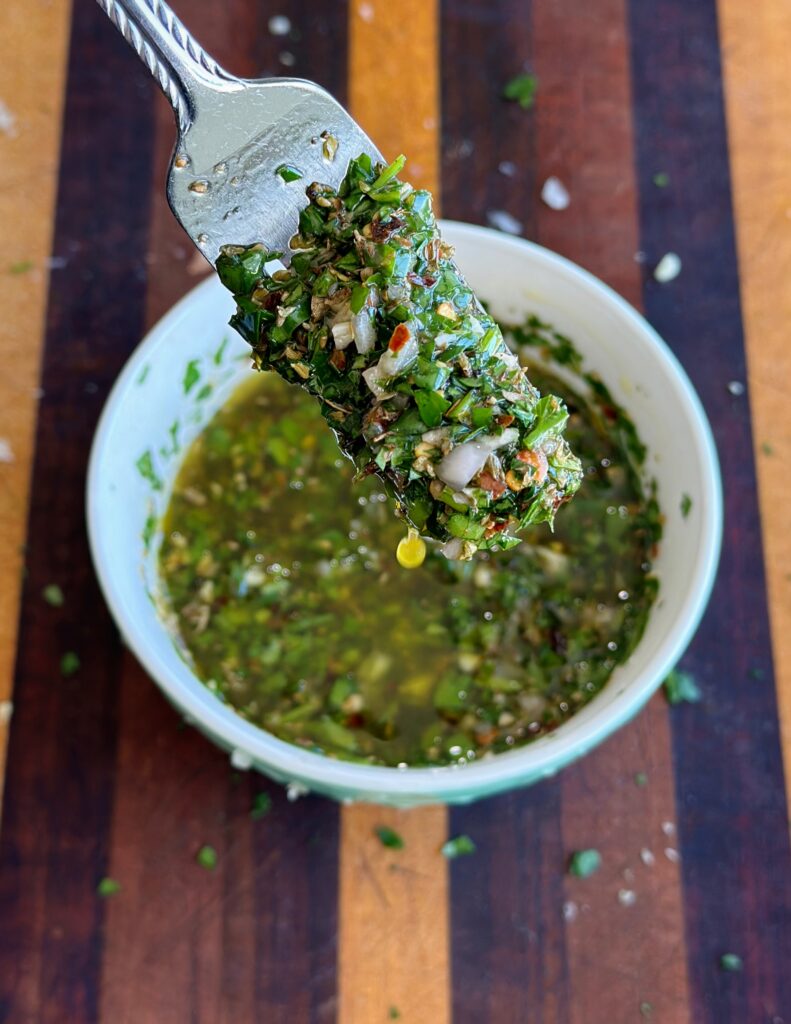 Chimichurri sauce mixed in a small bowl. 